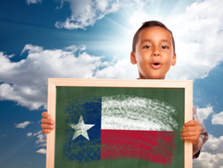 A Boy Holding A Frame With National Flag