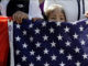 USA and Mexican flag in the hand of a child