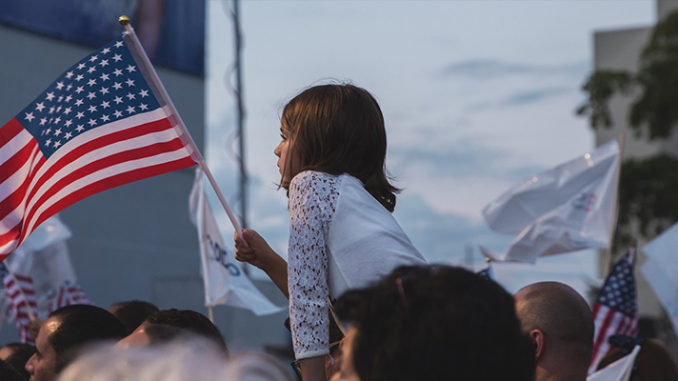 A Girl Holding National Flag and The New Swing Voters