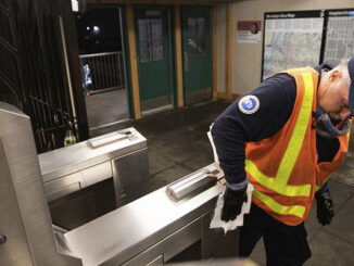 The worker is working wearing his uniform