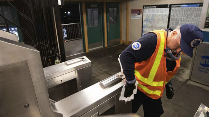 The worker is working wearing his uniform