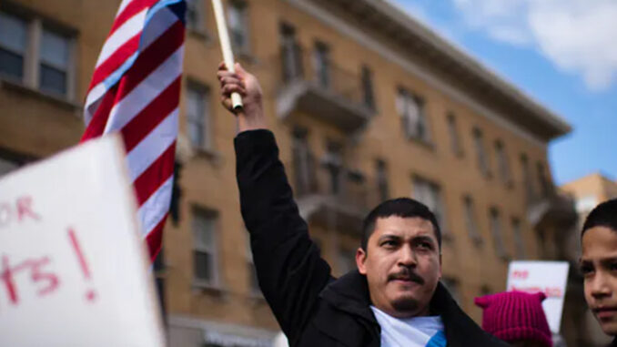 Safe Communities A Man Holding National Flag