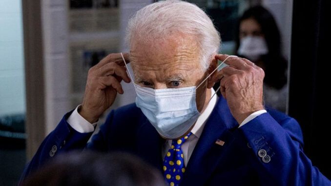 Picture of Biden wearing mask keeping the healthcare guidelines
