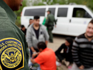 Latino Immigrants With Officer