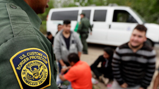 Latino Immigrants With Officer