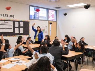 Mexican American student studying in the classroom.