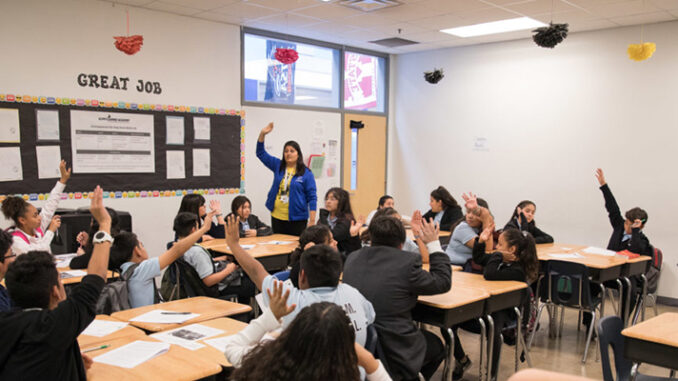 Mexican American student studying in the classroom.